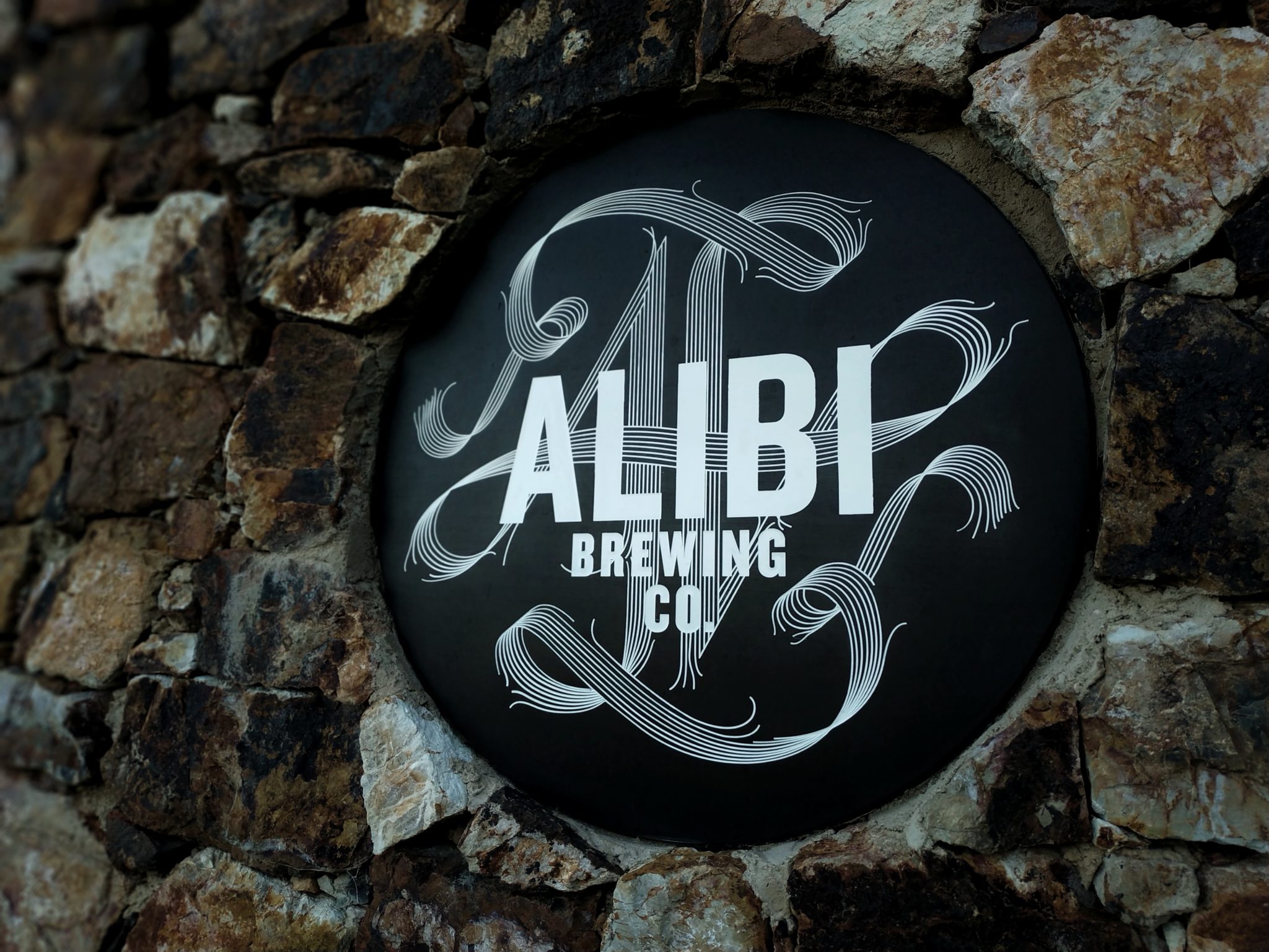 Alibi Brewing logo